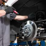 Inspecting brakes as part of a Chevy service schedule