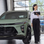 Customer speaking with salesperson at a Chevrolet dealership